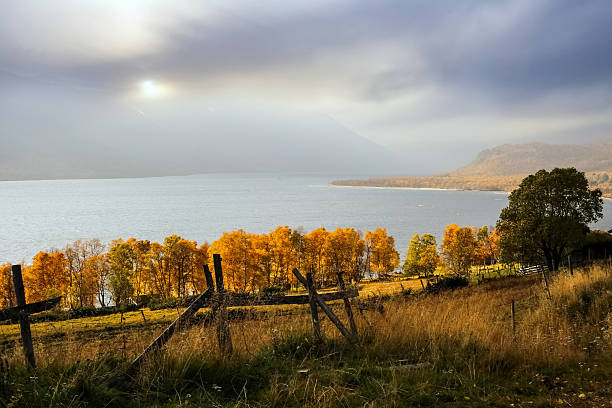 Autumn at the lake Gjevillvatnet located in the Oppdal county, Norway. View of the mountains in the National Park Trollheimen