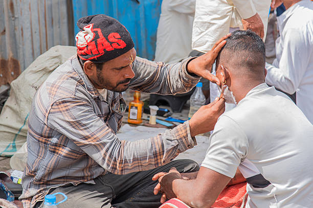 Rajasthan, India - March 02, 2006: Barber shop on the streets of Jaipur city