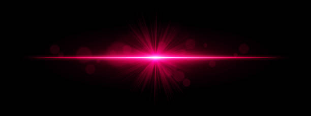 istock Light burst. Star-shaped flash with radial rays and soft bokeh on black background, ideal for magic, fantasy or romantic glow effects. 2220898861