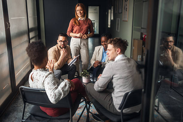 istock Group of Professionals Collaborating in a Cozy Office Environment 2220899587
