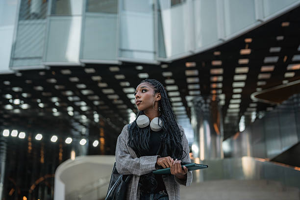 istock Businesswoman talking on the phone while walking to work 2220901070