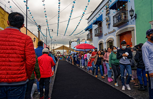 Huamantla, Tlaxcala, Mexico - August 14, 2022: Streets with incidental people during the celebration of Nadie Duerme holiday