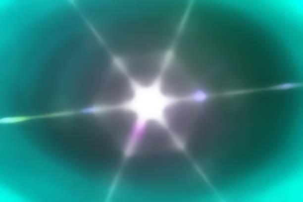 Light rays beaming through a vibrant turquoise background, creating a stunning array of colorful lens flares and glowing effects