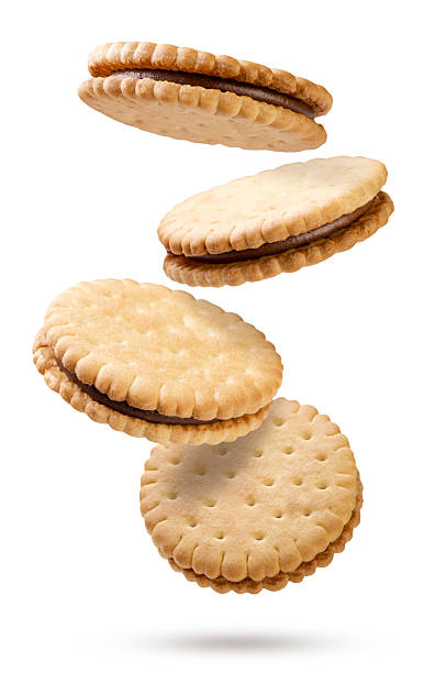 istock Sandwich cookies falling on a white background. Isolated 2220906309
