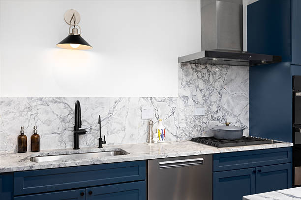 istock A kitchen detail with blue cabinets and marble countertop. 2220907916