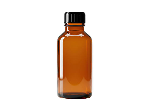 istock Isolated Amber Glass Bottle with Black Cap 2220908258