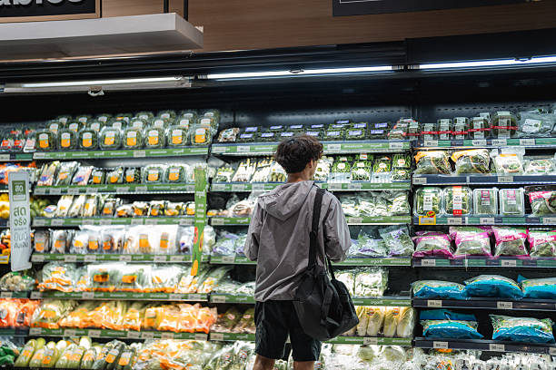 Close-up shot of a man picking groceries from the shelf