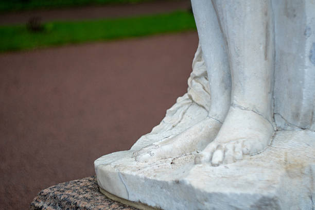 istock Marble statue close-up of elegant feet in park setting 2220910336