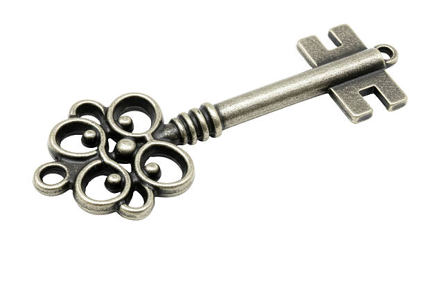 istock Isolated Antique Bronze Key with Decorative Ornamentation 2220911982