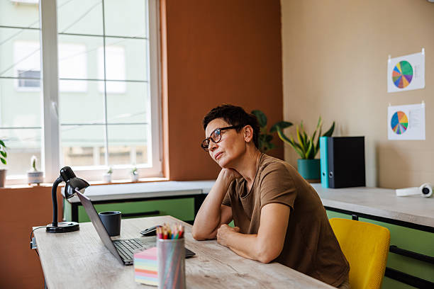 istock Tired Businesswoman Taking a Break From Office tasks 2220915331