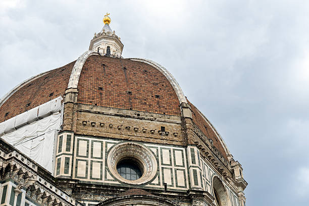 istock Brunelleschi's dome of Florence cathedral under cloudy sky 2220917454