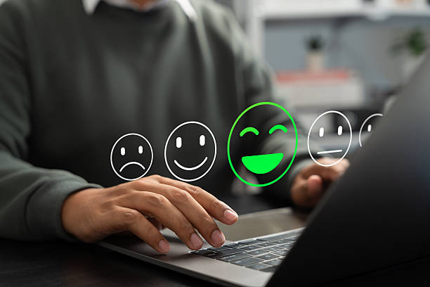 istock Customer using tablet give five star rating, Submit satisfaction survey through online application. Positive feedback highlight excellent service and product quality, improving brand reputation. 2220921473