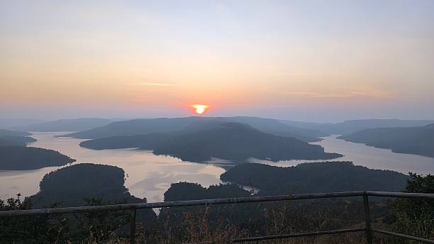 istock Sunset Over River Islands and Mountain Ridges in Rural India 2220923811