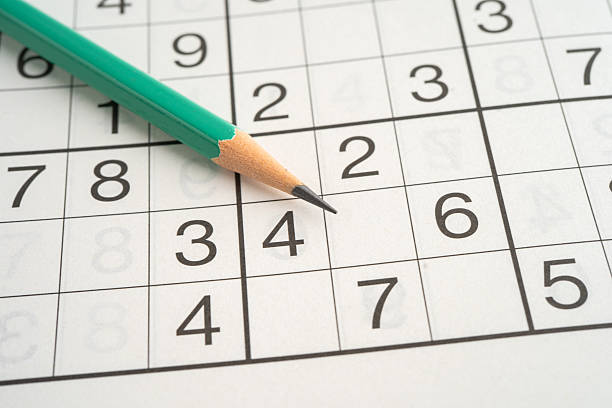 istock Sudoku puzzle game playing to challenge brain. 2220924394