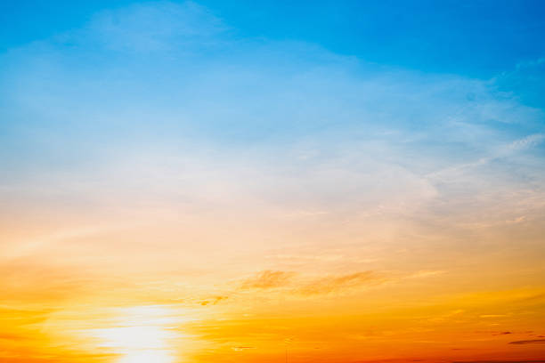 Beautiful , luxury soft gradient orange gold clouds and sunlight on the blue sky perfect for the background, take in evening,Twilight, Large size, high definition landscape photo, savanna view