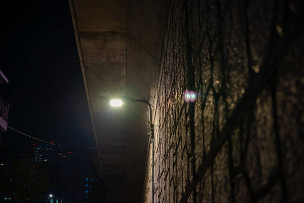 stone walls and streetlights below the viaduct.