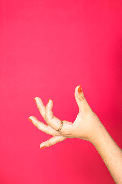 Painting red nail polish on toes