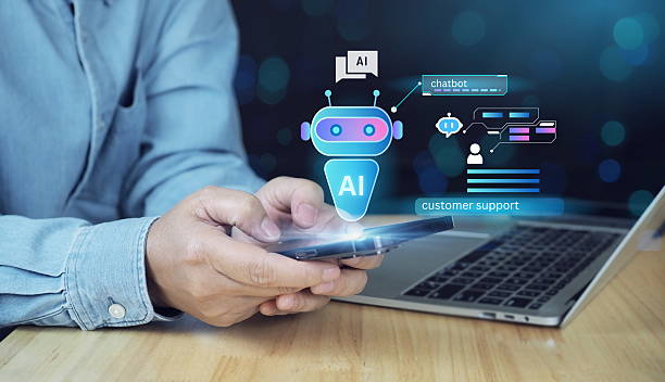 istock hand holding mobile phone showing AI chatbot interface. A digital chatbot handling live customer queries with an interactive helpdesk UI. Suitable for illustrating automation in business support. 2220933009