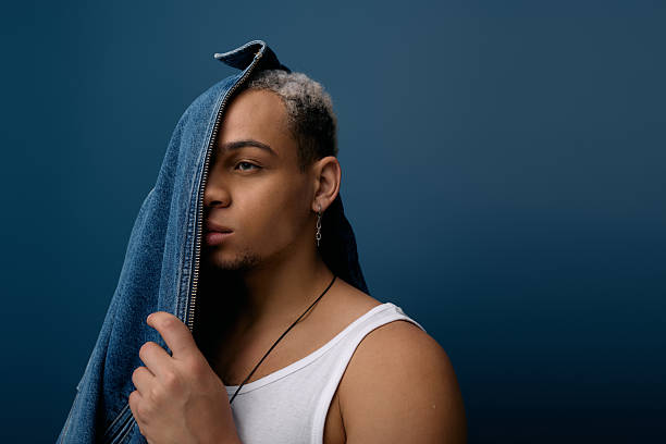 istock Youthful expression of style with denim on a vibrant blue backdrop 2220933178