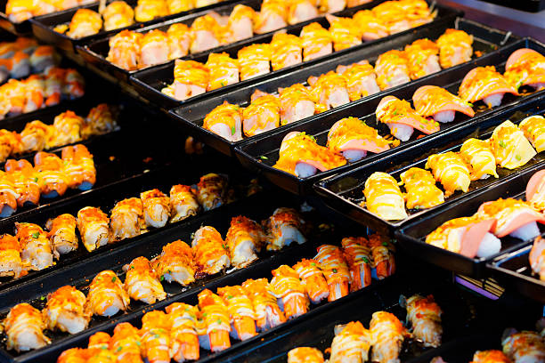 istock Rows of thai sushi on plates 2220938937