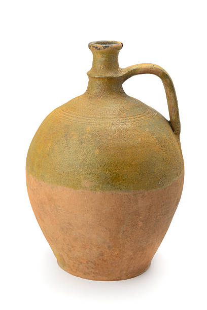istock Antique wine amphora isolated on white 2220942063