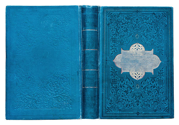istock Old open blue book cover with embossed golden abstract pattern and floral decorations isolate on white background. Abstract vintage decorations 19th century. 2220943500