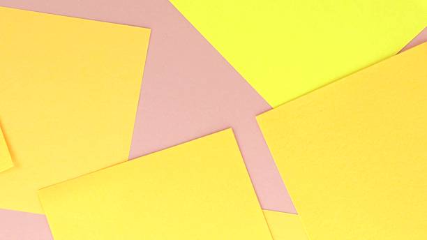 istock Notes and post-it notes paper is blown off the desktop by the fan airflow, top view 2220945075
