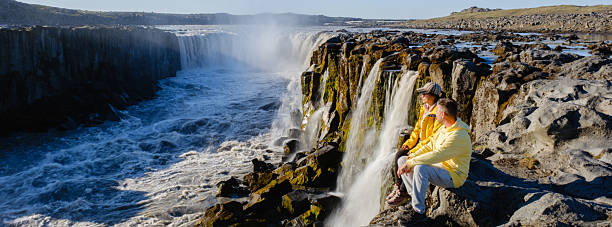istock Enchanting waterfall views in Iceland with visitors exploring the natural beauty 2220946073