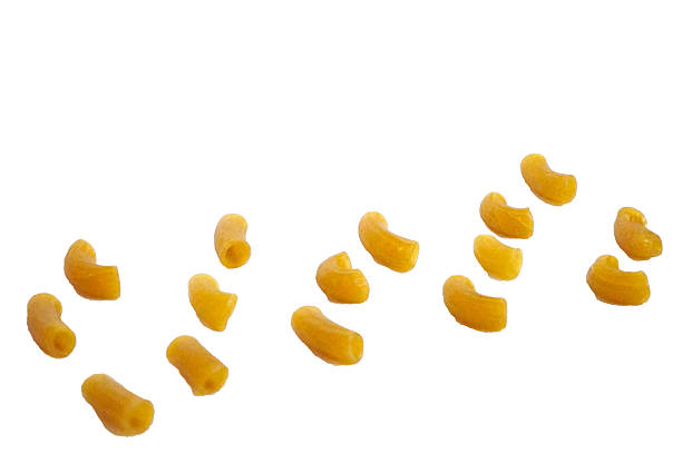 istock scattered raw elbow macaroni pieces isolated on white background 2220948198