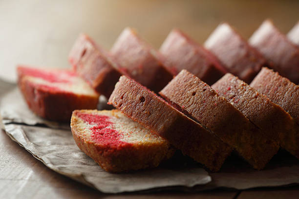 Soft and moist slices of vanilla and red velvet marble cake, baked to perfection with a beautiful swirl of flavors.