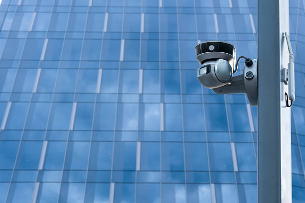 istock CCTV camera front of office building. Close-up. 2220952777