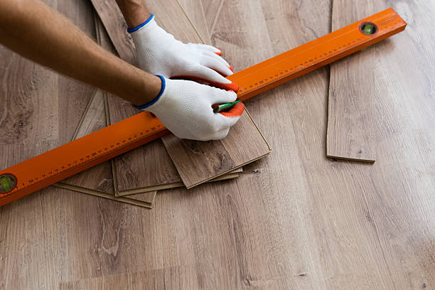 istock Laminate Flooring Improvement. Installer Contractor Installing New Floor. 2220952780