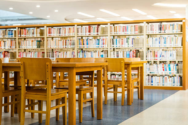 istock Public library with wooden tables and chairs 2220954063