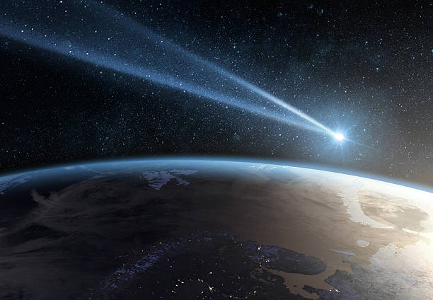Comet, asteroid, meteorite flying to the planet Earth.  Glowing asteroid and tail of a falling comet threatening the safety of the Earth.  Elements of this image furnished by NASA.