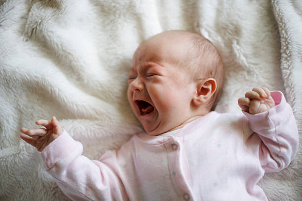 istock Newborn baby girl crying 2220958800