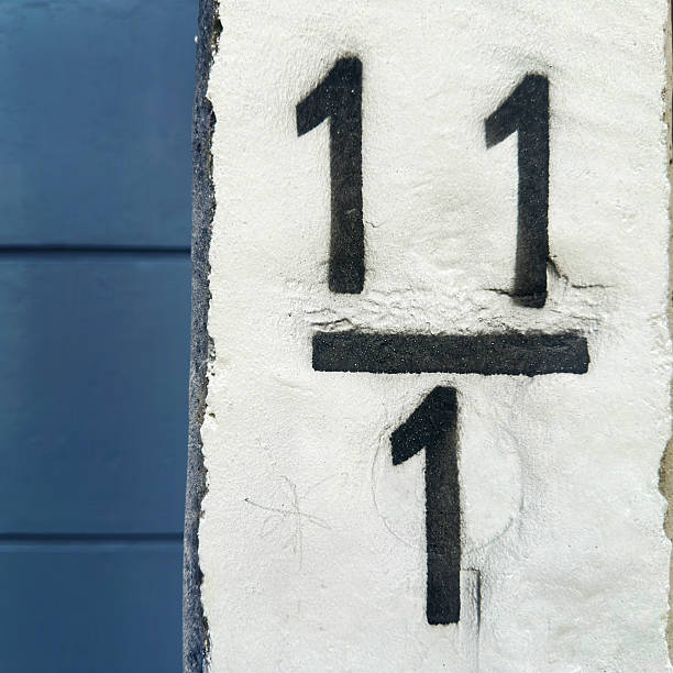 istock Close up number 1 1 1 painted on concrete block 2220964546