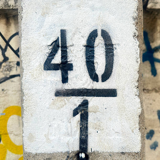 istock Close up number  40 and number 1 painted on concrete block 2220964783