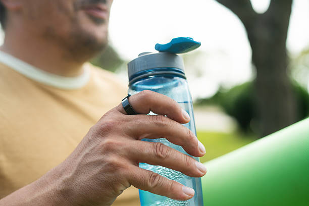 istock Man with smart ring and yoga mat in a park in summer 2220967450
