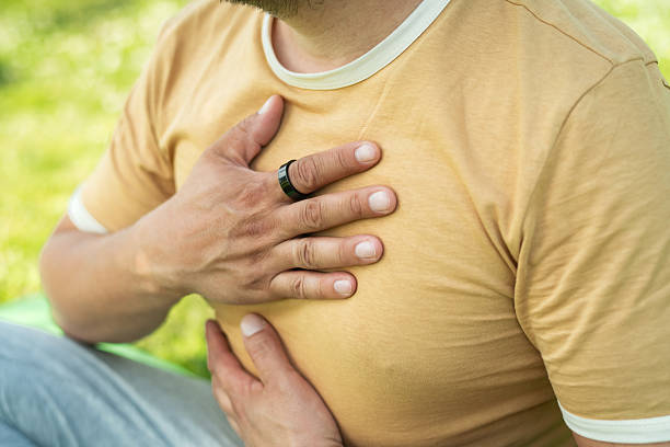 istock Man with smart ring practicing yoga outdoors 2220967537