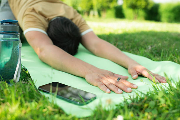 Man practicing yoga outdoors
