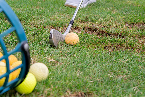 istock Engaging in Golf Practice Perfecting Your Swing with an Iron at the Driving Range 2220971739
