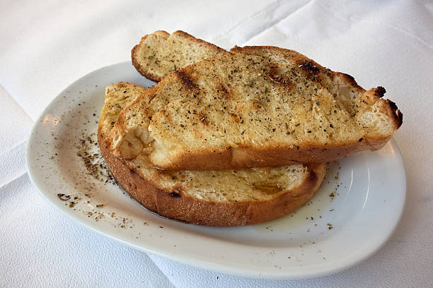 It’s humble, but powerful. Earthy bread, fire-forged, meeting the liquid gold of pressed olives—Greece on a plate.