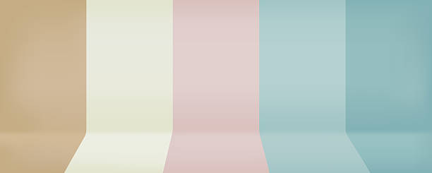 istock The minimalist backdrop features four vertical panels of beige, light yellow, light pink, and light blue. 2220975136
