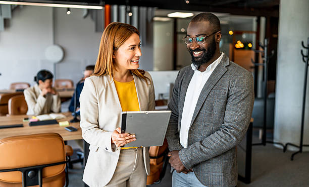 istock Business colleagues discussing work in modern office 2220975412