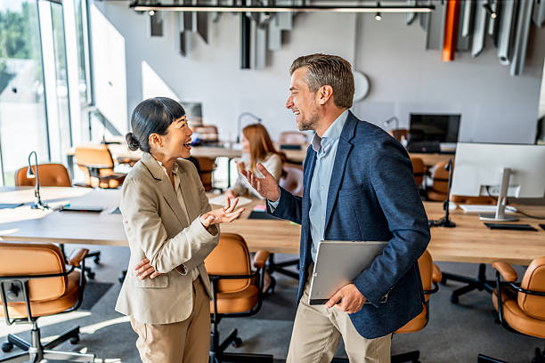istock Business people talking and walking in modern office 2220975714