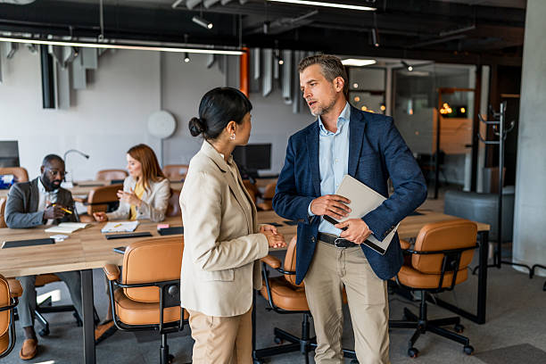 istock Businesspeople discussing work in modern office environment 2220975940