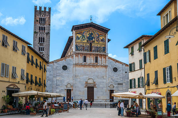 Lucca, Tuscany, Italy - June 05, 2025: The Basilica of San Frediano is one of the oldest places of worship in the Tuscan city, famous for the splendid mosaic on the Byzantine-style facade dating back to the end of the 13th century.