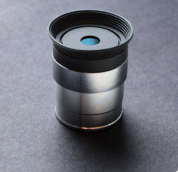 istock Telescope eyepiece with metal body isolated on black background 2220978095