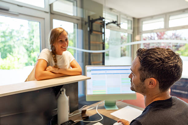 istock Physical therapist assisting patient with exercise plan in clinic 2220978690