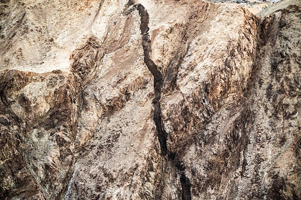 Sedimentary rock with a dark line of the Fish river majestic cliffs